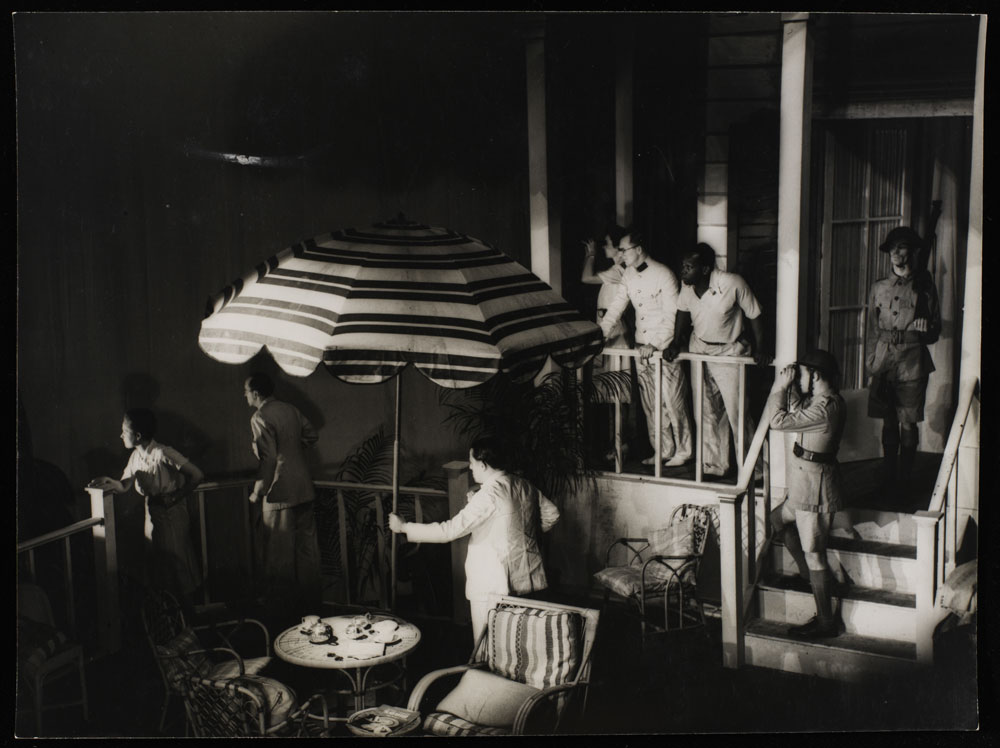 Black and white photograph of actors on stage in the Colony