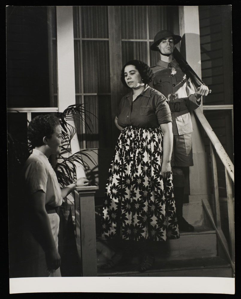 Black and white photograph of actors on stage in the Colony