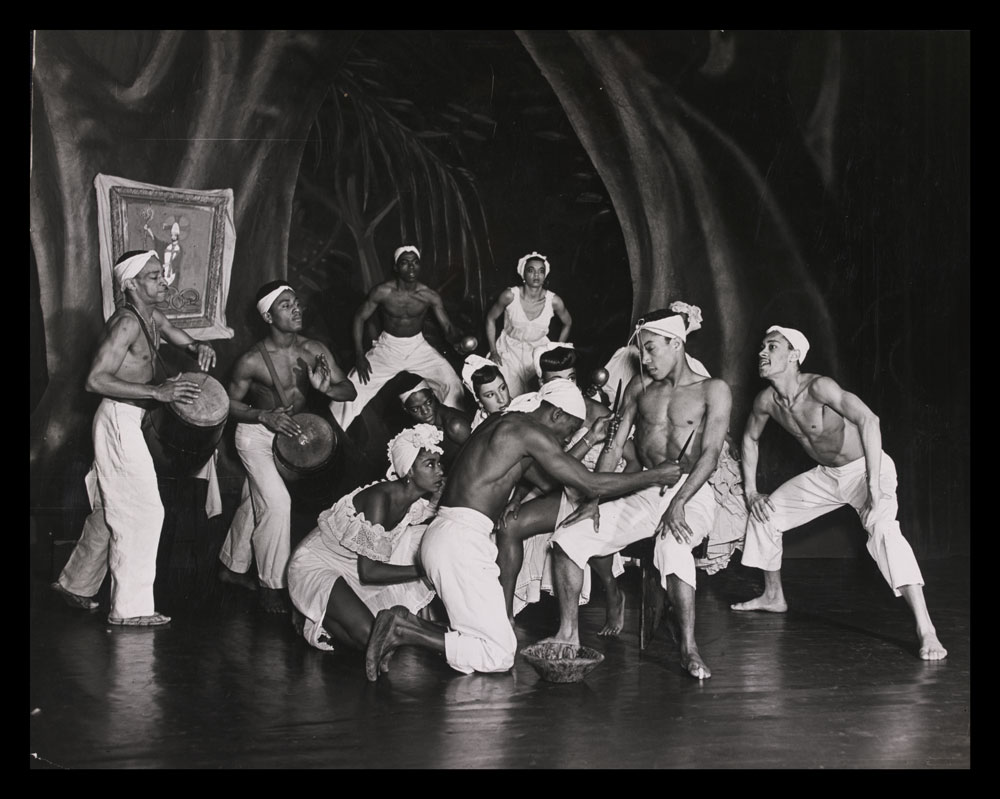 Black and white photograph of performers on stage in Shango-A Caribbean Rhapsody