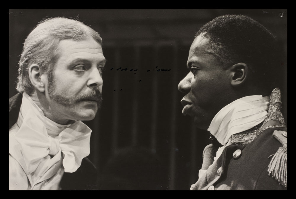 Photograph of actors looking at each other from The Black Jacobins