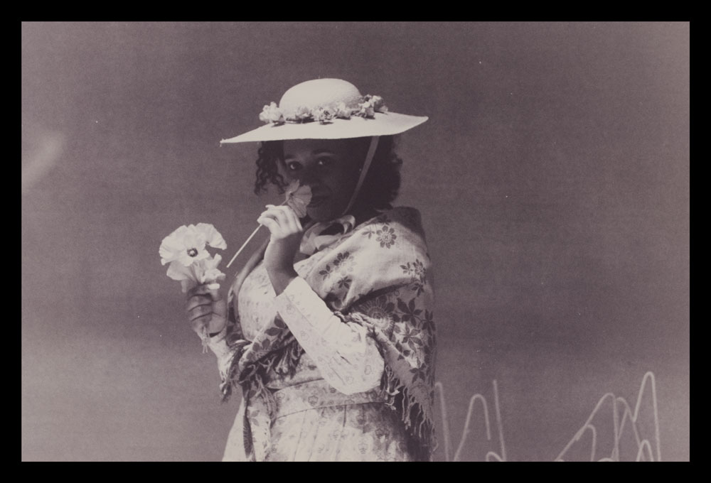 Photograph of woman with flower from Flyin' West