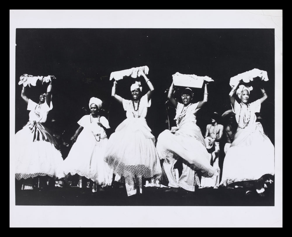 Black and white photograph of performers on stage in The Capoeiras of Bahia