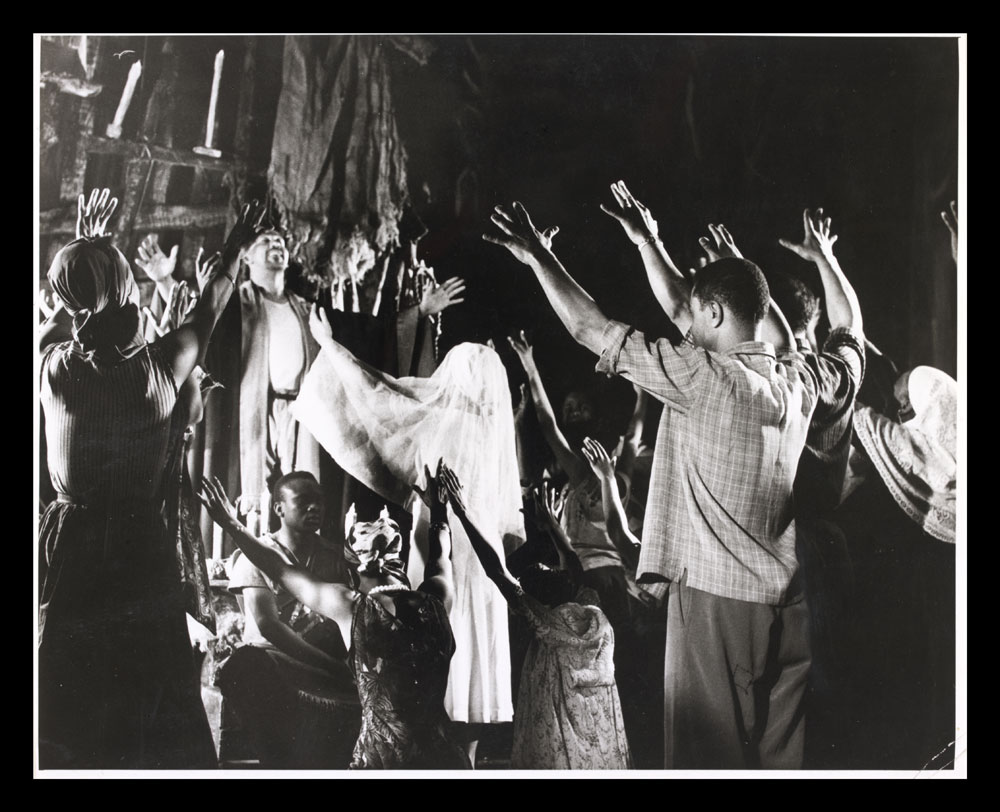 Black and white photograph of actors on stage in Flesh to a Tiger