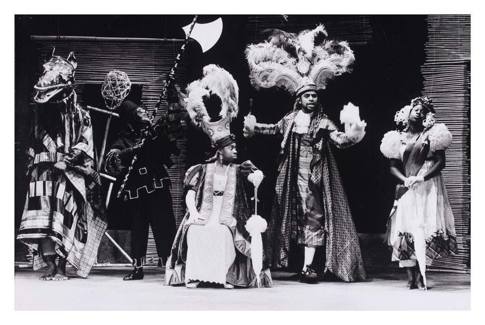 Photograph of actors on stage from Maskarade